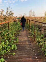 woman walking on a bridge