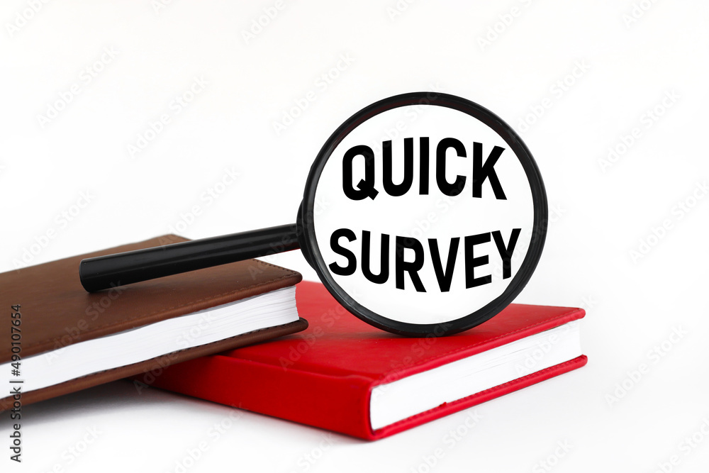 Poster magnifier on a notepad on a white background. text on glass. quick survey.