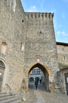 Main entrance of the medieval village of P&eacute;rouges in the sunset light.
