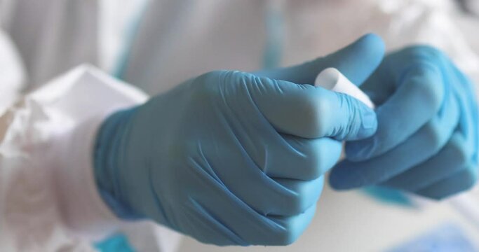 Process of coronavirus PCR antigen testing examination by nurse medic in laboratory lab, COVID-19 swab collection kit, test tube for taking OP NP patient specimen sample, patient receiving test, 4K 
