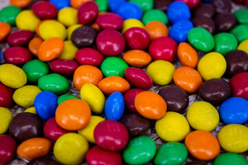 Small candies close-up. Background, multicolored dragees.