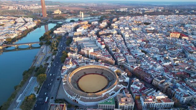 Aerial view of Seville, famous European historic city and capital of Andalusia, corrida bullring Plaza de toros de la Real Maestranza de Caballeria de Sevilla