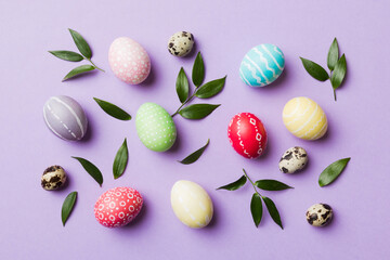 Obraz na płótnie Canvas Colorful Easter eggs with spring flower leaf isolated over white background. Colored Egg Holiday border