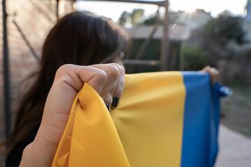 Ukrainian woman holding her flag. 