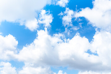 Obraz na płótnie Canvas White clouds in the blue sky background.