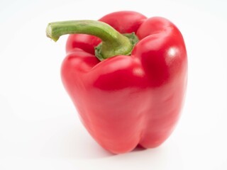 Red paprika on a white background. Fresh paprika.