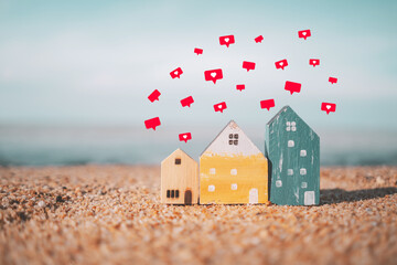 Happy neighbor small model house with heart icon flying on tropical beach abstract background. Home...