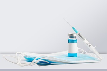 Bottle of Covid-19 vaccine on medical desk