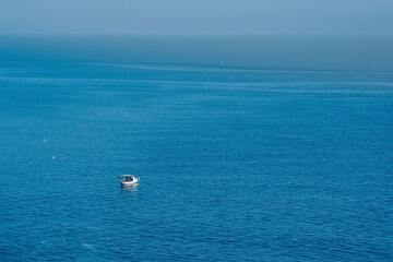 seascape with a lonely fishing boat, view from above