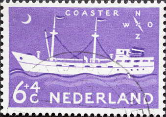 Netherlands - circa 1957: a postage stamp from the Netherlands , showing the Coastal motor vessel at sea .