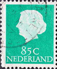 Netherlands - circa 1956: a postage stamp from the Netherlands , showing a portrait of the Queen of...
