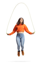 Trendy young female skipping a rope