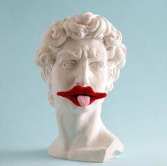 Statue of  David  head  with  with red lips and protruding tongue on  blue background. Minimal art poster.