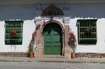 Fototapeta premium Colonial house entrance in Santa Fe of Antioquia, Colombia