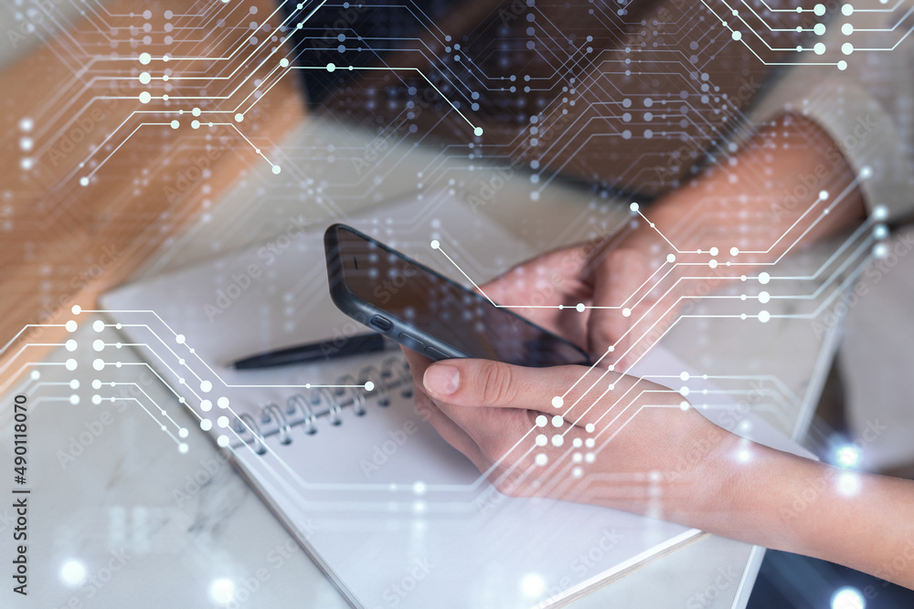 Poster businesswoman in formal wear holding in the hands a smart phone and testing an innovative applicatio
