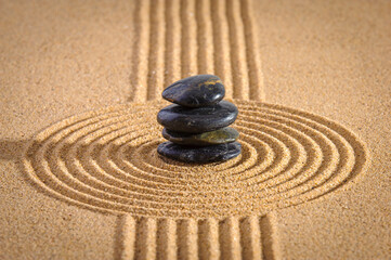 Fototapeta na wymiar Japanese ZEN garden with yin yang stone in textured sand
