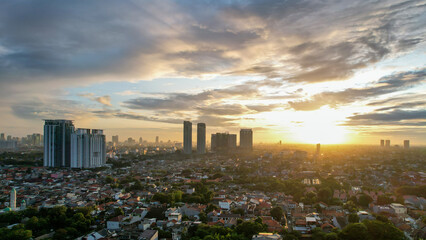 Fototapeta premium Aerial view of Jakarta Central Business District shot from a drone at sunrise. Jakarta, Indonesia, March 2, 2022