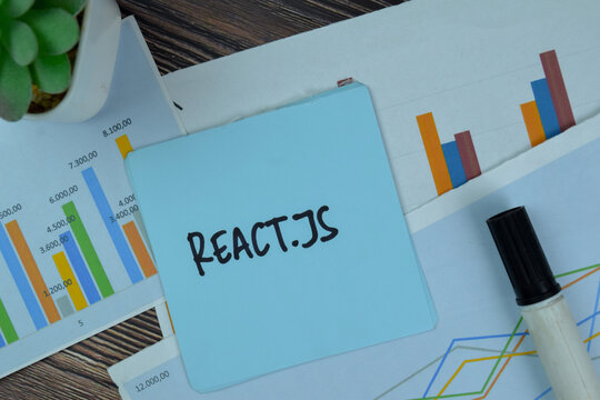 React.JS write on sticky notes isolated on Wooden Table.
