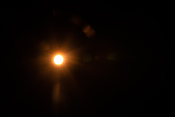 Solar lens flare on black background