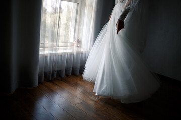 Fototapeta na wymiar Beautiful young girl bride on a wedding day. White wedding dress. Modern dressy clothes for women
