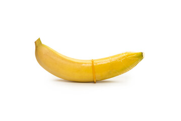 A banana with a condom on it isolated on white background.