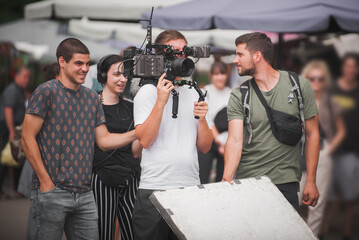 Behind scenes. Film crew team shooting movie scene. Group filmmaking