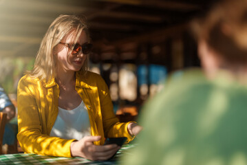 Woman is looking at menu in restaurant.