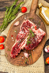 Classic T-bone steak isolated on white background. Hard light, dark shadow, mockup, template