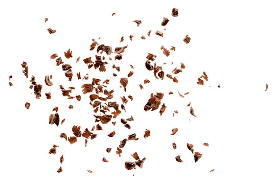 Grated chocolate chips on a white background, top view. Chocolate chips on a white background, top view. Pieces of grated chocolate isolated on white background, top view. © aneriksson