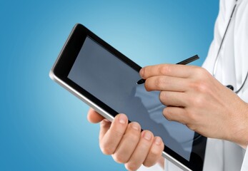 Beautiful young doctor, with a tablet for records. Medical student general practitioner. The concept of medical education