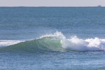 Wave breaking in the sea.