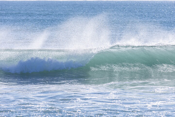 Wave breaking in the sea.
