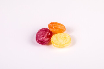 Colored stack of candies on a white background. Lollipops and sweets