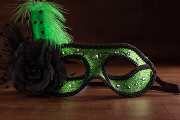 Carnival masks, beautiful Venetian masks in detail on a table, selective focus.