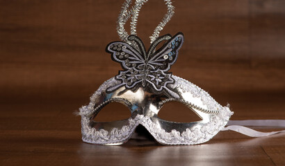 Carnival masks, beautiful Venetian masks in detail on a table, selective focus.