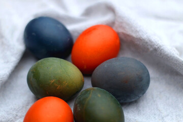 Colorful Easter eggs on neutral fabric. Selective focus.