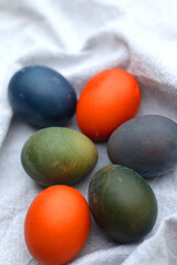 Colorful Easter eggs on neutral fabric. Selective focus.