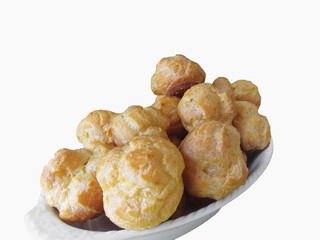 Delicious beignets composed of a shell of choux pastry on white background