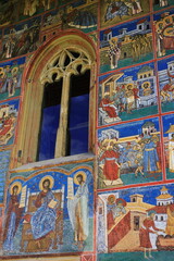 Fototapeta na wymiar Painted wall at Voronet Monastery in Bucovina, Romania. It is one of the famous painted monasteries from Romania.