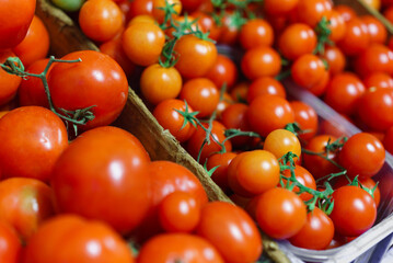 Red tomatoes food background, food closeup in Store.