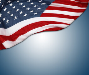 Fototapeta premium American flag on blue background. Copy space
