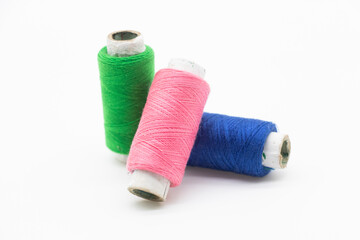 Colorful yarn on spool, yarn on tube, cotton, wool, linen thread, polyester selective focus on red spool