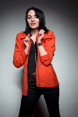 Brunette girl wear orange jacket