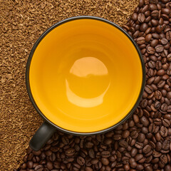 Large empty ceramic cup on sublimated and bean coffee background in close-up