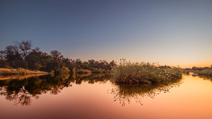 Beautiful  colorful sunset on the river Okavango in Namibia
