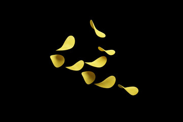 Crispy potato chips flying in the air. On an black background. Fast food.