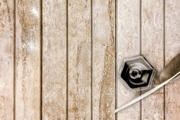 Quill pen with a glass bottle of ink on the desk
