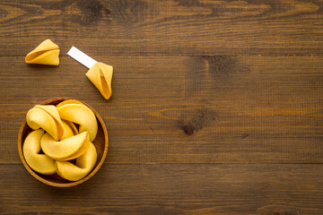 Many Chinese New Year fortune cookies in bowl. Asian New Year background