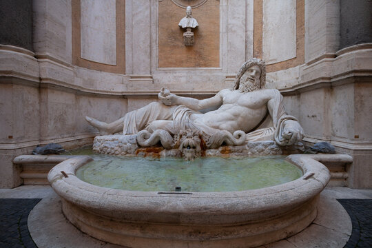 Scenic view of an antique sculpture of Marforio against Capitoline Museum Palazzo Nuovo in Italy