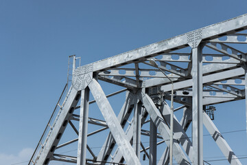 Metal construction. Beam gray bridge. Metal bridge.